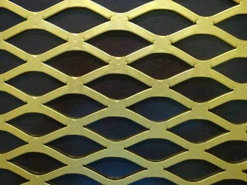 Golden aluminum expanded metal meshes with diamond holes are installed on interior wall.