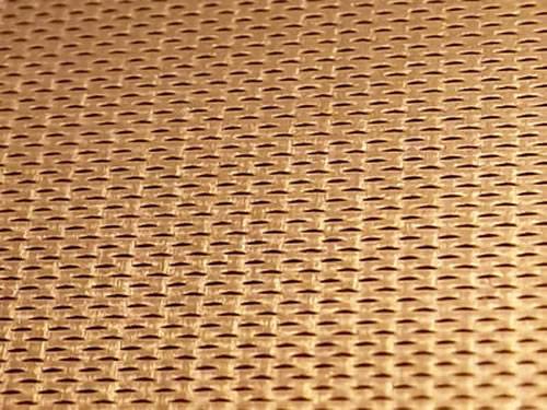 Golden aluminum expanded metal meshes with diamond holes are installed on interior wall.