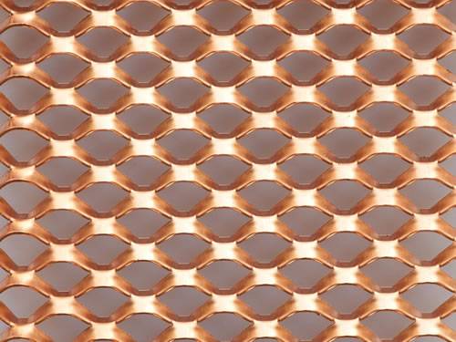 Green aluminum expanded metal meshes with diamond holes are installed on the architectural building facades by trellis.