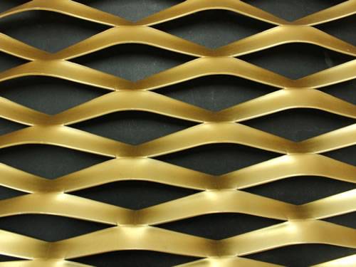 Green aluminum expanded metal meshes with diamond holes are installed on the architectural building facades by trellis.