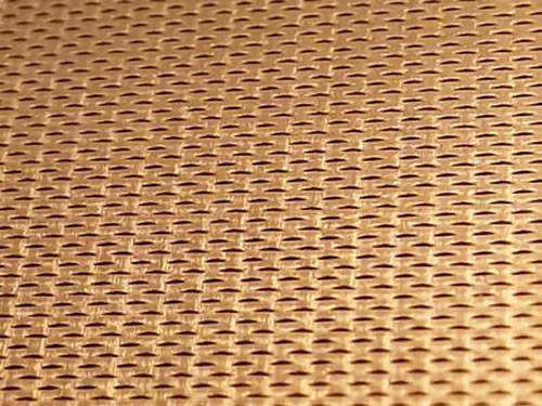 Golden aluminum expanded metal meshes with diamond holes are installed on interior wall.