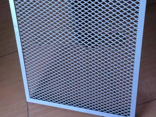 Green aluminum expanded metal meshes with diamond holes are installed on the architectural building facades by trellis.