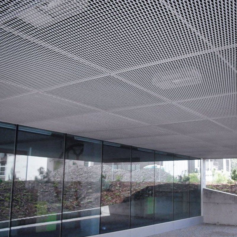 Golden aluminum expanded metal meshes with diamond holes are installed on interior wall.
