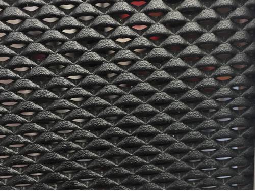 Green aluminum expanded metal meshes with diamond holes are installed on the architectural building facades by trellis.