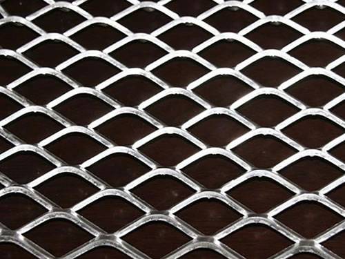 Green aluminum expanded metal meshes with diamond holes are installed on the architectural building facades by trellis.