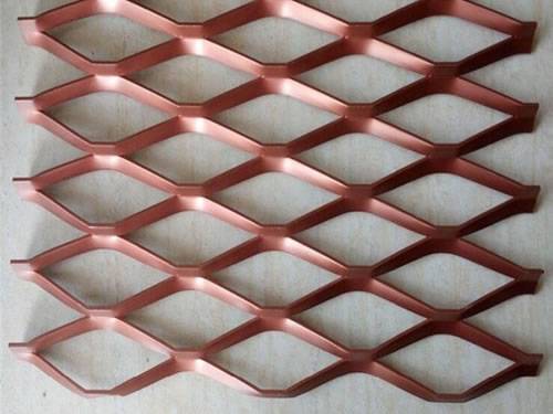 Green aluminum expanded metal meshes with diamond holes are installed on the architectural building facades by trellis.