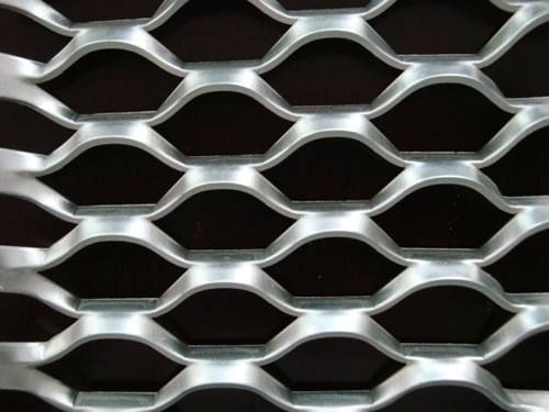 Green aluminum expanded metal meshes with diamond holes are installed on the architectural building facades by trellis.