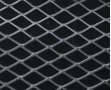 Golden aluminum expanded metal meshes with diamond holes are installed on interior wall.