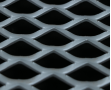 Golden aluminum expanded metal meshes with diamond holes are installed on interior wall.
